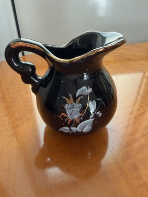 Small vintage ceramic milk jug used with gold details
