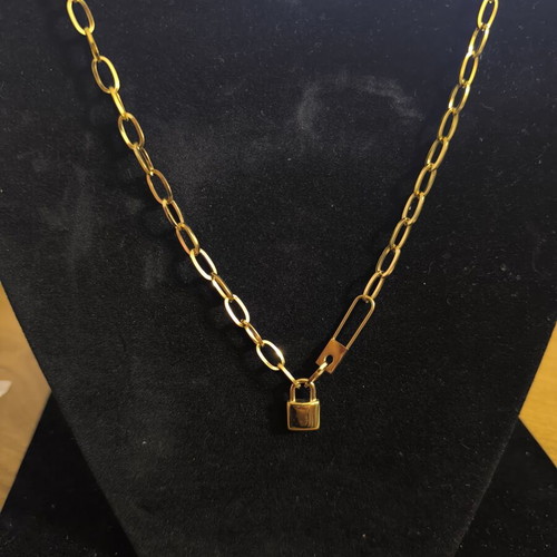 Modern necklace with decorative lock in gold color, new