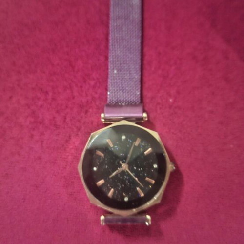 Wristwatch women's used with magnetic clasp purple color