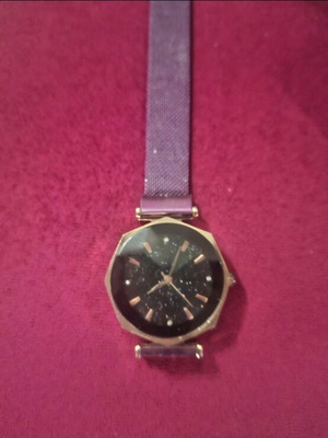 Wristwatch women's used with magnetic clasp purple color