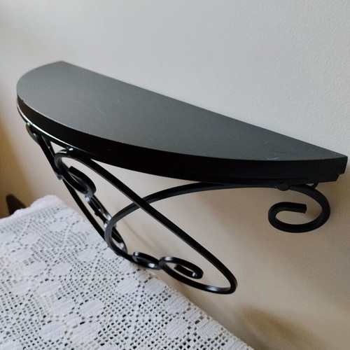 Wall shelf with black metal frame and wooden top, like new