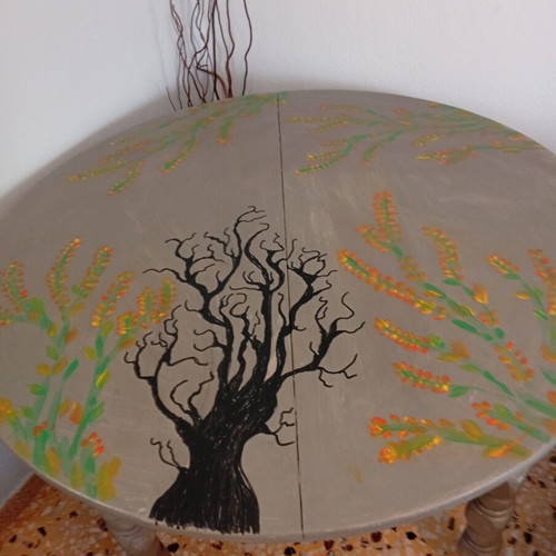 Round table with painted design, chalk paint