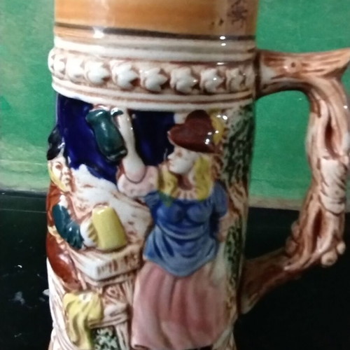 Decorative ceramic beer mug like new with embossed designs