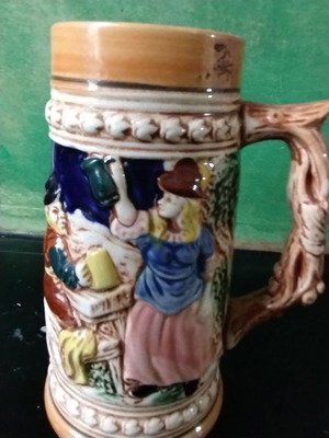 Decorative ceramic beer mug like new with embossed designs