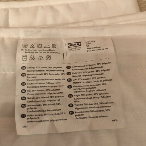 IKEA crib mattress pad used with stain