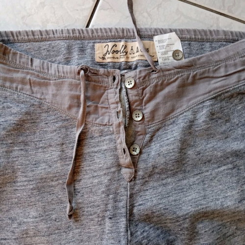 Gray harem-style sweatpants used, with zipper at the hem