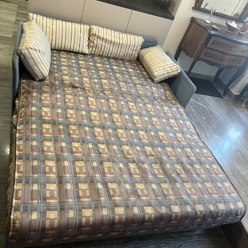 Two-Seater Sofa Bed used, practical and space-saving