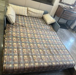 Two-Seater Sofa Bed used, practical and space-saving