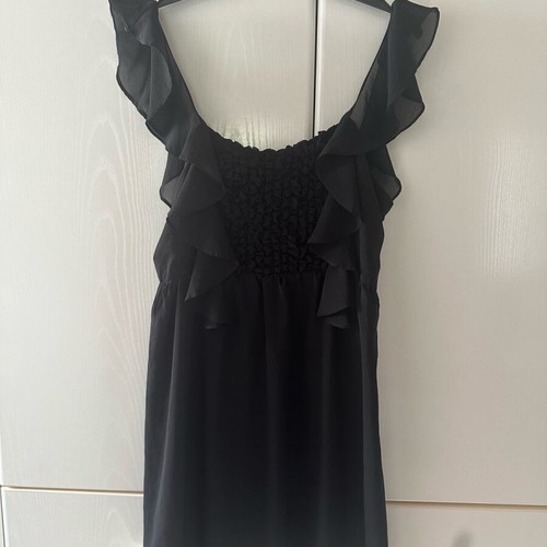 Black dress with ruffles used, size medium