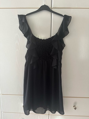 Black dress with ruffles used, size medium