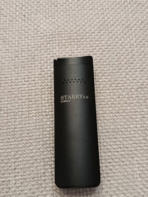 XMax Starry 3.0 vaporizer used with charging cable