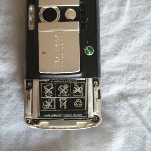 Sony Ericsson mobile phone used, missing back cover