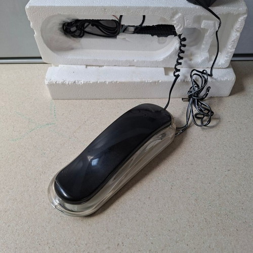 Vintage wired home phone with transparent neon design, new