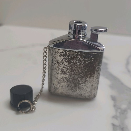 Vintage lighter used, flask design silver color
