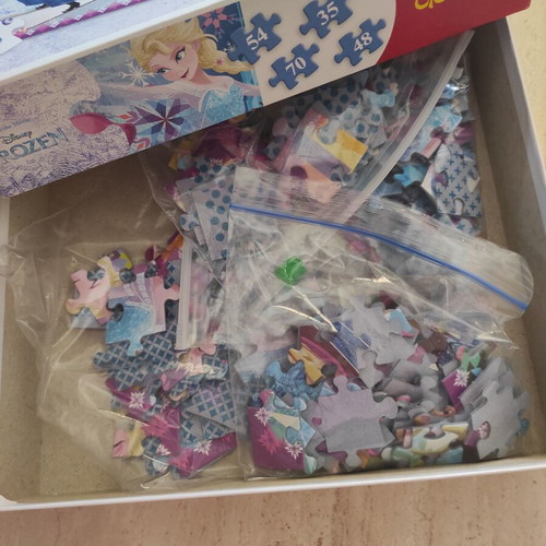 Frozen puzzle set like new with Ravensburger and Trefl