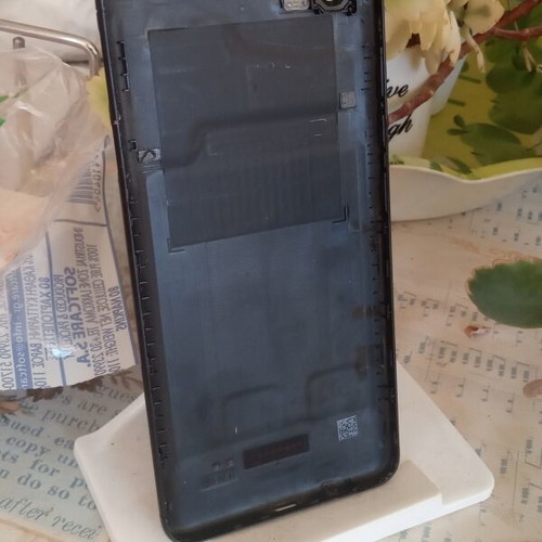 Redmi 6A black back cover with cracked camera lens