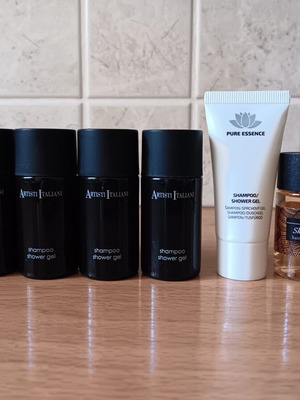 Mini travel care products set, new, 13 bottles with branded shower gels and soaps