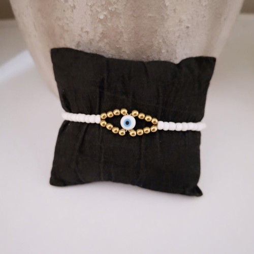 Handmade bracelet with white and gold beads, eye design, adjustable