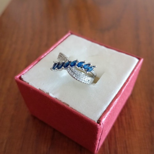 Ring new, gold plated with blue and silver zircon stones, size 7