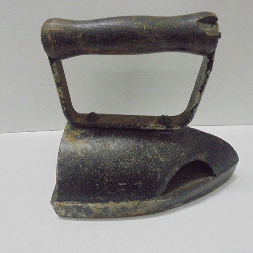Old cast iron iron with internal heating plate used