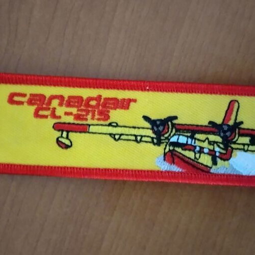 Remove Before Flight fabric keychain in excellent condition