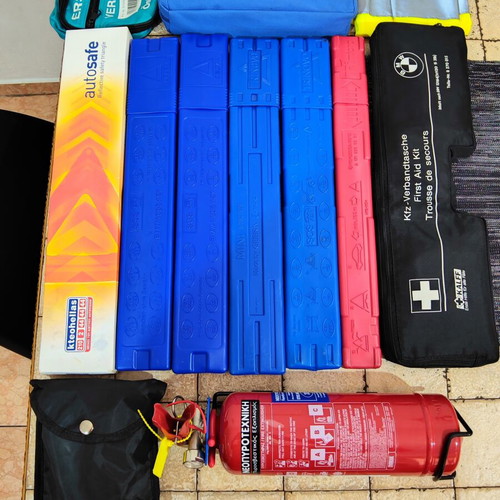 Car safety kit with fire extinguisher, triangles, first aid kits, shovel, vest