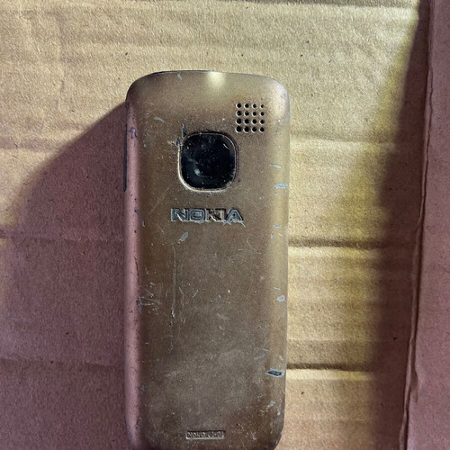 Nokia C1 phone used with broken screen without battery