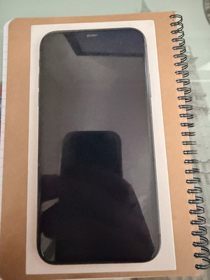 Apple iPhone 11 64GB smartphone with screen damage
