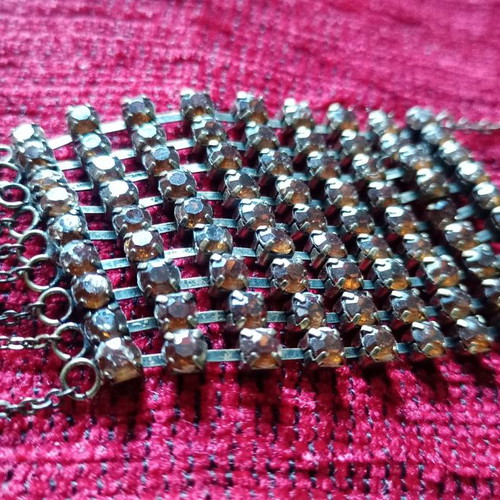 Alternative necklace used with rows of yellow crystals on antique bronze