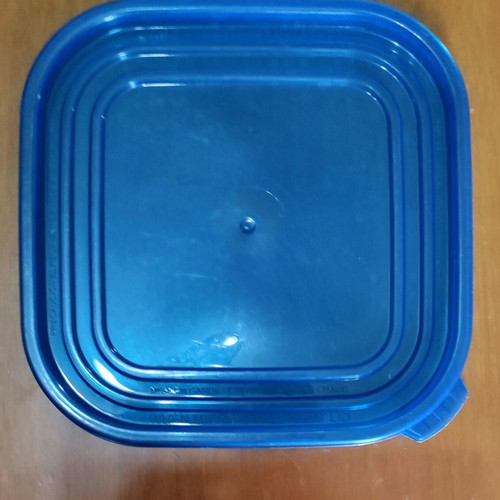 Kitchen utensils used, strainer in tupperware with lids