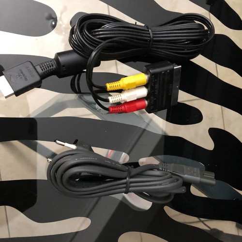 Sony PlayStation console used with official bag, controller and cables