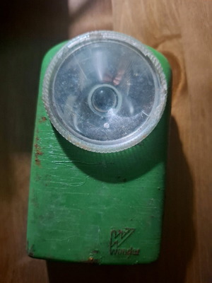 Wonder vintage flashlight used with green casing