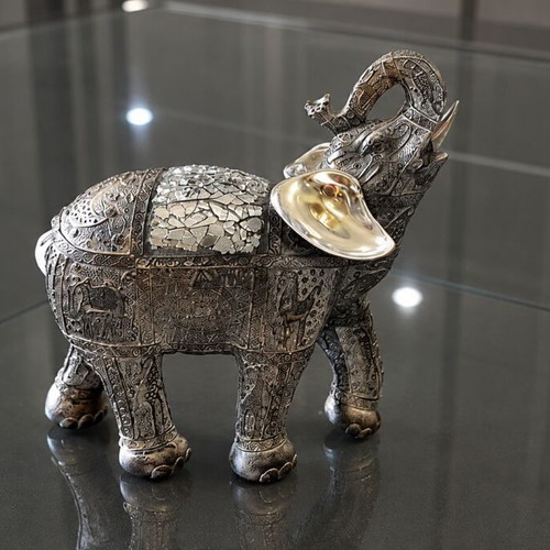 Decorative elephant vintage with embossed Asian-inspired carvings used