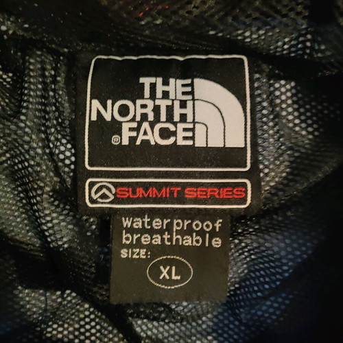 The North Face men's jacket used blue and black waterproof windbreaker