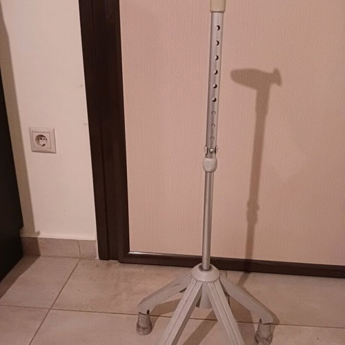 Walking cane with four-legged base used
