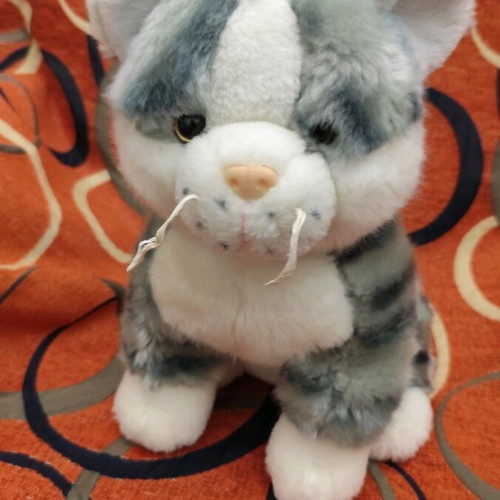 Plush cat like new, 30 cm height and length