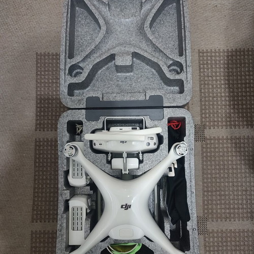 DJI Phantom 4 drone with accessories (no working batteries)
