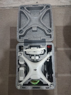 DJI Phantom 4 drone with accessories (no working batteries)