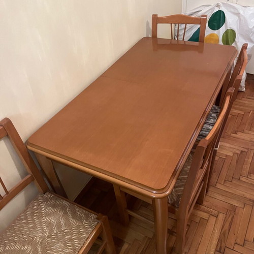 Wooden dining set used with 4 chairs and wicker seats