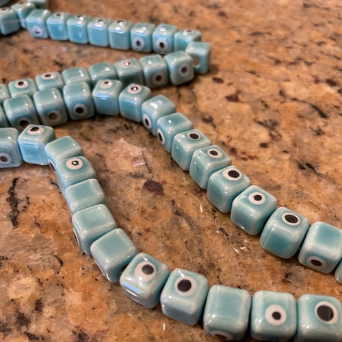 Enamelled ceramic evil eye beads new, pack of 100, turquoise