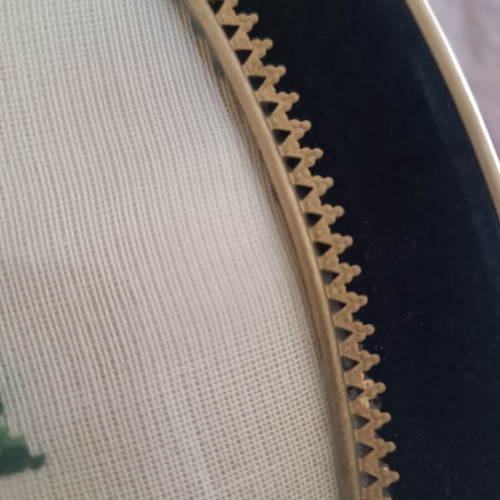 Vintage handmade cross-stitch frame with velvet oval border used