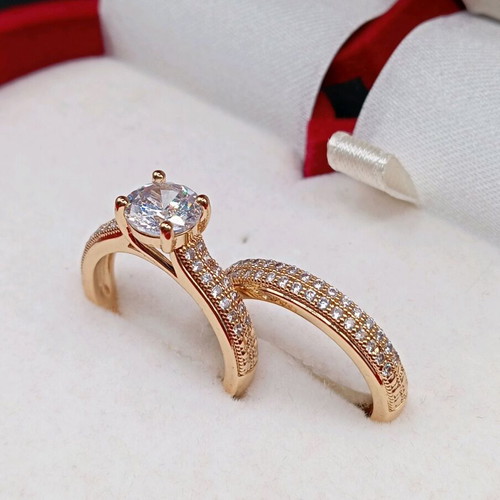 Set of solitaire ring and wedding band plated new with zircon