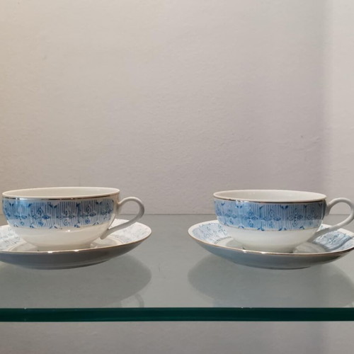 Set of two used Chinese tea cups with blue design and silver trim