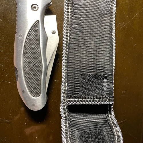 Folding knife with half serrated blade like new