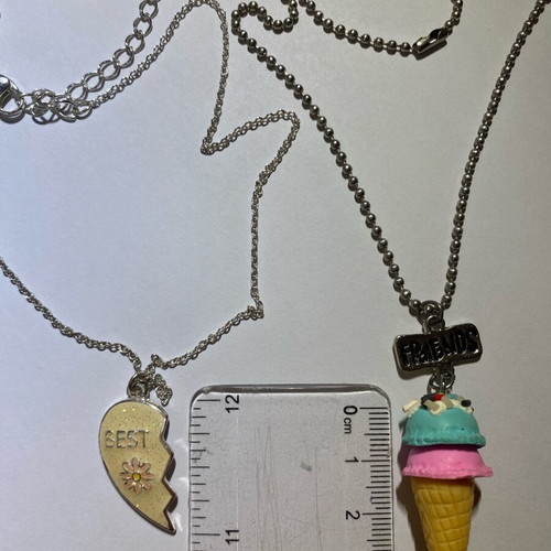 Claire's necklace like new with thin chain and half heart design