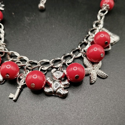 Bracelet and necklace set with red beads and metal charms new