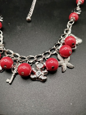 Bracelet and necklace set with red beads and metal charms new
