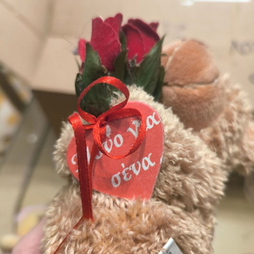 Plush teddy bear with roses like new, romantic gift