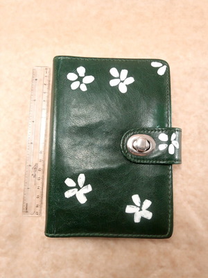 Organizer agenda used green cypress with clasp and white flowers
