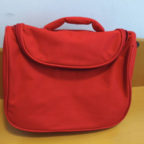 Toiletry bag used, red, practical and spacious travel case